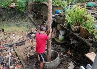 Hard at work building the posts in the water for the front of the Local Divers shop.